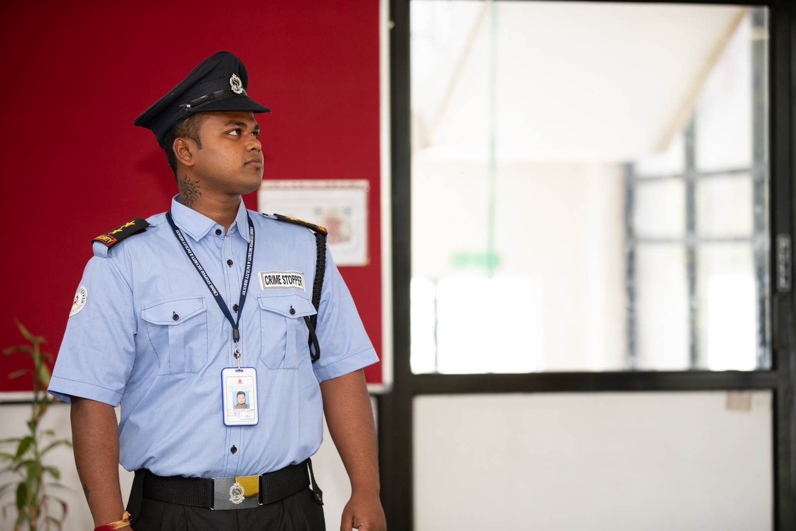 Indian security guard on duty at a building entrance